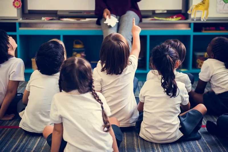 Pupils taking part in a classroom lesson
